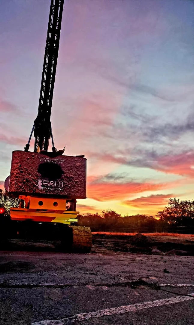 Pier Drilling Rig in the sunset after a long day of Foundation Repair on a Commercial Construction Jobsite as a Foundation Contractor