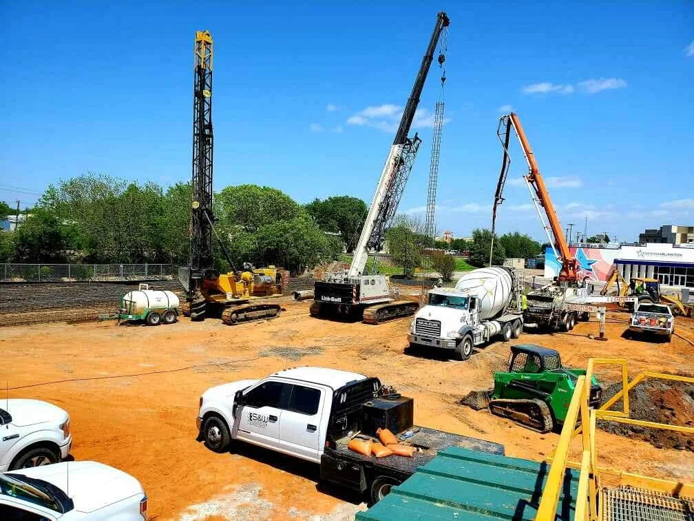 S&W Trucks and Cranes at a Commercial Pier Drilling jobsite